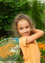 Portrait of cute smiling little girl playing tennis in summer Royalty Free Stock Photo