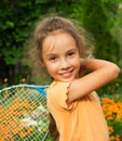 Portrait of cute smiling little girl playing tennis in summer Royalty Free Stock Photo