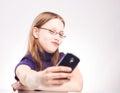 Portrait of a cute teen girl with phone taking selfie Royalty Free Stock Photo