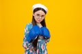 Portrait of a cute teenage boxer girl on yellow isolated background. Funny winner child girl. Success, leader concept.