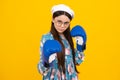 Portrait of a cute teenage boxer girl on yellow isolated background. Funny winner child girl. Success, leader concept.