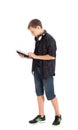 Portrait of a cute teenage boy with headphones and tablet computer. Royalty Free Stock Photo