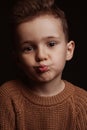 Portrait of cute white Caucasian child preschooler kid boy making an air kiss with lips Royalty Free Stock Photo