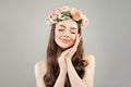 Portrait of cute woman. Beautiful model with clear skin, long hair and flowers. Relaxation, aromatherapy Royalty Free Stock Photo