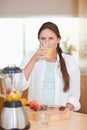 Portrait of a cute woman drinking fresh fruits juice