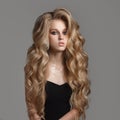 Portrait of cute woman with long wavy hair.