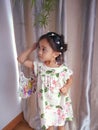 Portrait cute 3 year old Asian little girl wearing a summer fashion clothes and accesories posing indoor Royalty Free Stock Photo