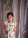 Portrait cute 3 year old Asian little girl wearing a summer fashion clothes and accesories posing indoor Royalty Free Stock Photo