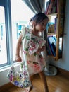 Portrait cute 3 year old Asian little girl wearing a summer fashion clothes and accesories posing indoor Royalty Free Stock Photo