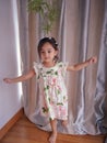 Portrait cute 3 year old Asian little girl wearing a summer fashion clothes and accesories posing indoor Royalty Free Stock Photo