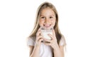 Portrait of a cute 7 years old girl Isolated over white background with milk glass Royalty Free Stock Photo