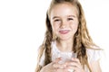 Portrait of a cute 7 years old girl Isolated over white background with milk glass Royalty Free Stock Photo