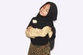 Portrait of cute A young asian little girl 6-7 years old muslim, wearing hijab, show face expression
