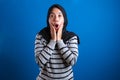 Portrait of cute young Asian muslim college student girl wearing hijab shows surprised or shocked expression Royalty Free Stock Photo