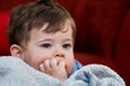 portrait of a cute young boy and his safety blanket