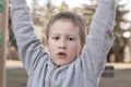 Portrait of cute young boy looking at the camera on children playground. Pre-school child having fun on playground. Kid playing on Royalty Free Stock Photo