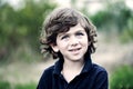 Portrait of a cute young boy outside Royalty Free Stock Photo