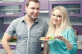 Portrait of a cute young couple standing in their kitchen Royalty Free Stock Photo