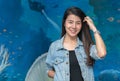 Portrait of cute young student in jacket jeans smile