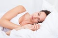 Portrait of a cute young woman sleeping on the bed Royalty Free Stock Photo