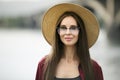 Portrait of a cute young woman wearing a hat and glasses. Urban style and fashionable clothes Royalty Free Stock Photo