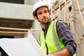 Portrait of cvil engineer with safety uniform working at construction site outdoor, Construction worker checking and