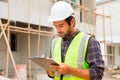 Portrait of cvil engineer with safety uniform working at construction site outdoor, Construction worker checking and