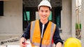 Portrait of cvil engineer with safety uniform working at construction site outdoor, Construction worker checking and