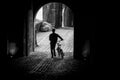 Cyclist silhouette crossing a dark tunnel