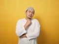 Portrait of cynical Asian muslim man with suspicious expression looking and starring, mistrust misdoubt Royalty Free Stock Photo