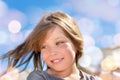 portrait of a pretty little girl with windy hair on the beach in summer Royalty Free Stock Photo