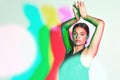 Portrait, dance or kaleidoscope and a ballet woman in studio on a white background with a colorful backdrop. Art, music