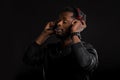 Portrait of young african man listening to music with headphones Royalty Free Stock Photo