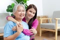 Portrait of a daughter with an elderly Asian mother smiling happily. Royalty Free Stock Photo