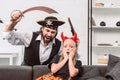 portrait of daughter and father in halloween costumes playing Royalty Free Stock Photo