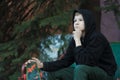 Portrait of daydreaming teenage skateboarder looking ahead