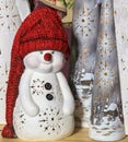 Portrait of a decorative toy snowman in a long red knitted hat Royalty Free Stock Photo