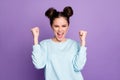 Portrait of delighted youngster girl enjoy rejoice coronavirus victory celebration raise fists scream yeah wear good Royalty Free Stock Photo