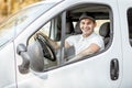 Portrait of delivery driver in the car