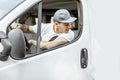 Portrait of delivery driver in the car Royalty Free Stock Photo