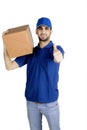 Delivery man showing thumb up on studio Royalty Free Stock Photo