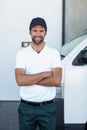 Portrait of delivery man is posing with crossed arms Royalty Free Stock Photo