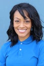 A portrait of a delivery young African woman isolated in blue background