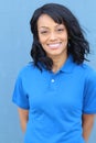 A portrait of a delivery young African woman isolated in blue background