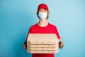 Portrait of deliveryman hold carton pizza boxes wear medical cold healthcare respiratory isolated on blue color