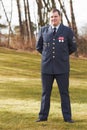 Portrait, Denmark and veteran general or official in uniform or flag on sleeve and male soldier outdoors. Danish Royalty Free Stock Photo