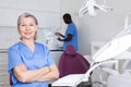 Portrait of dentist female and assistant in the workplace in clinic