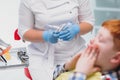 Portrait of a dentist holding dental instruments in his hands in the clinic close-up Royalty Free Stock Photo