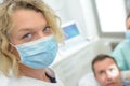 Portrait dentist in mask looking at camera dental clinic