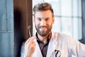 Portrait of a dentist near the window